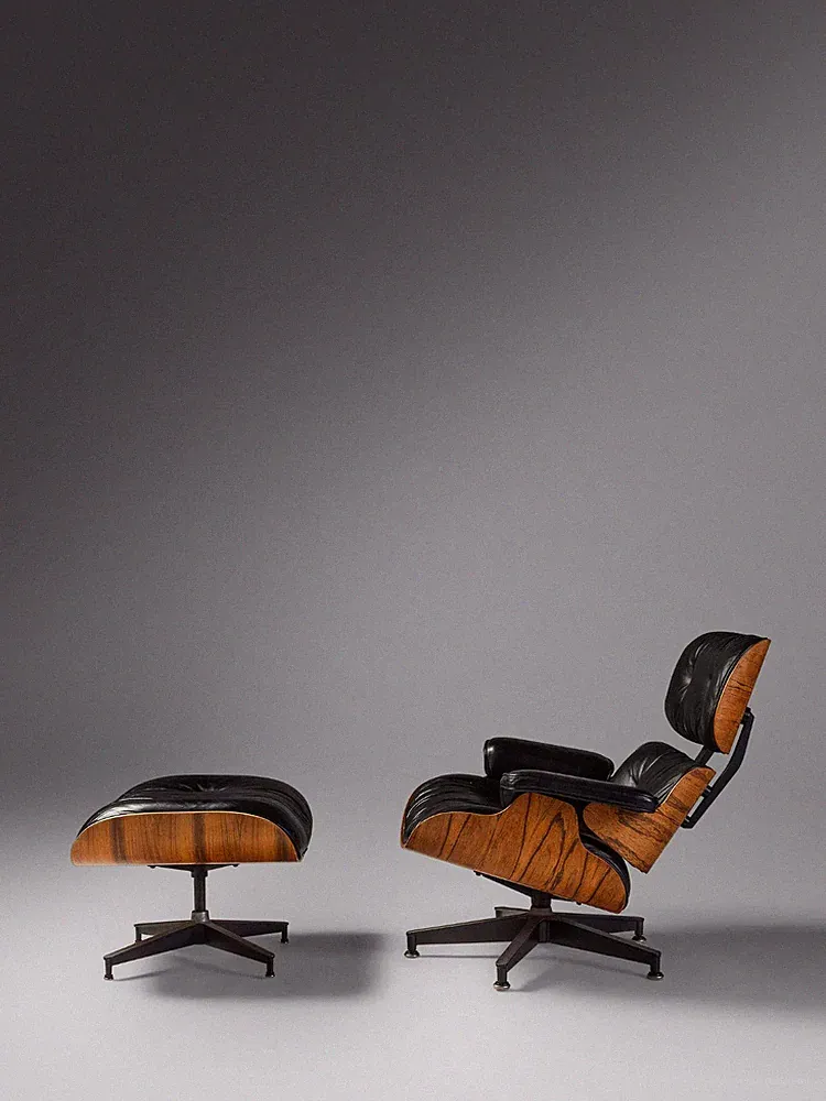A Rosewood Mid-century modern Eames lounge chair and ottoman 670 and 671
